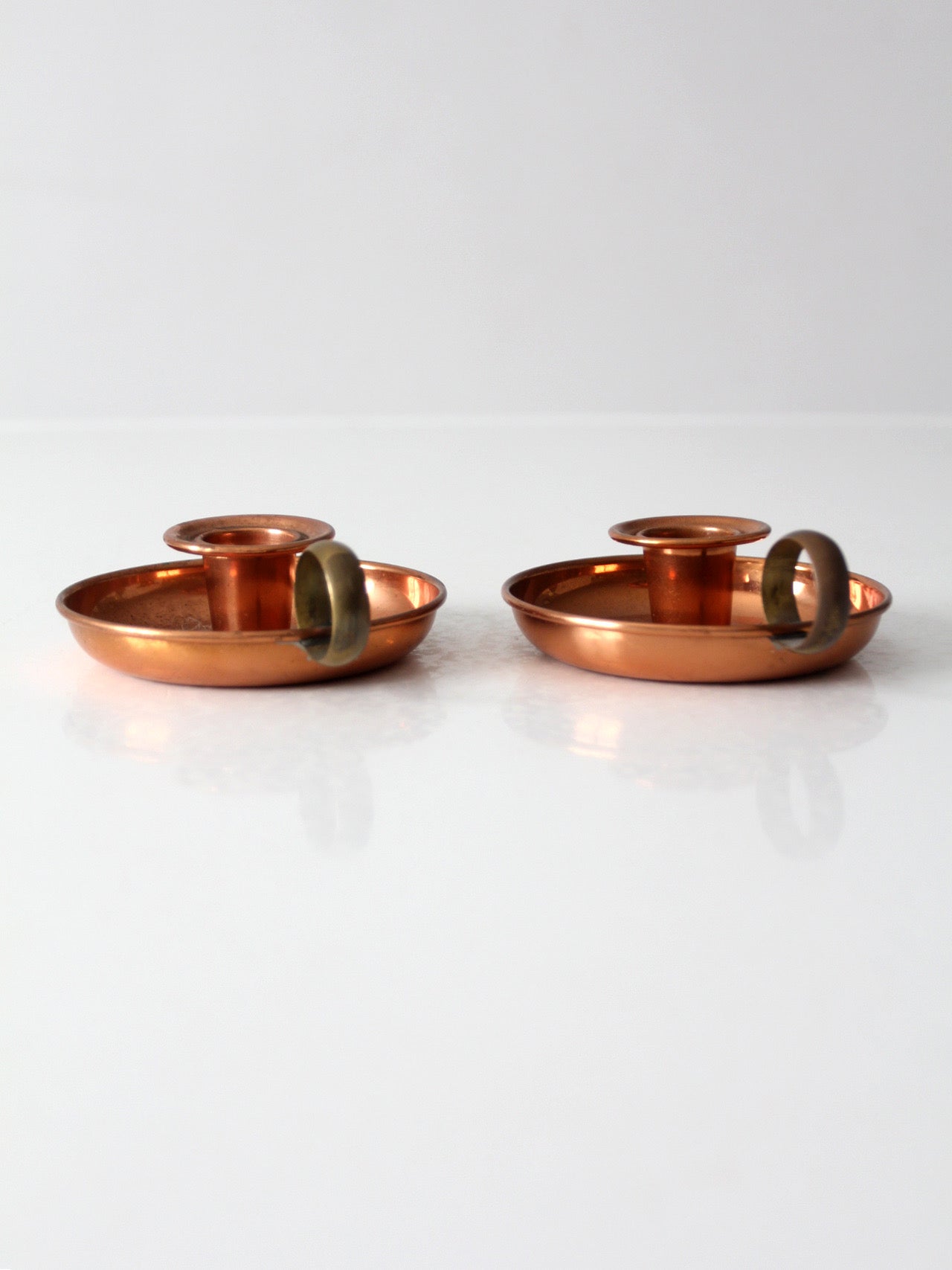 pair of vintage copper and brass chamberstick candlesticks