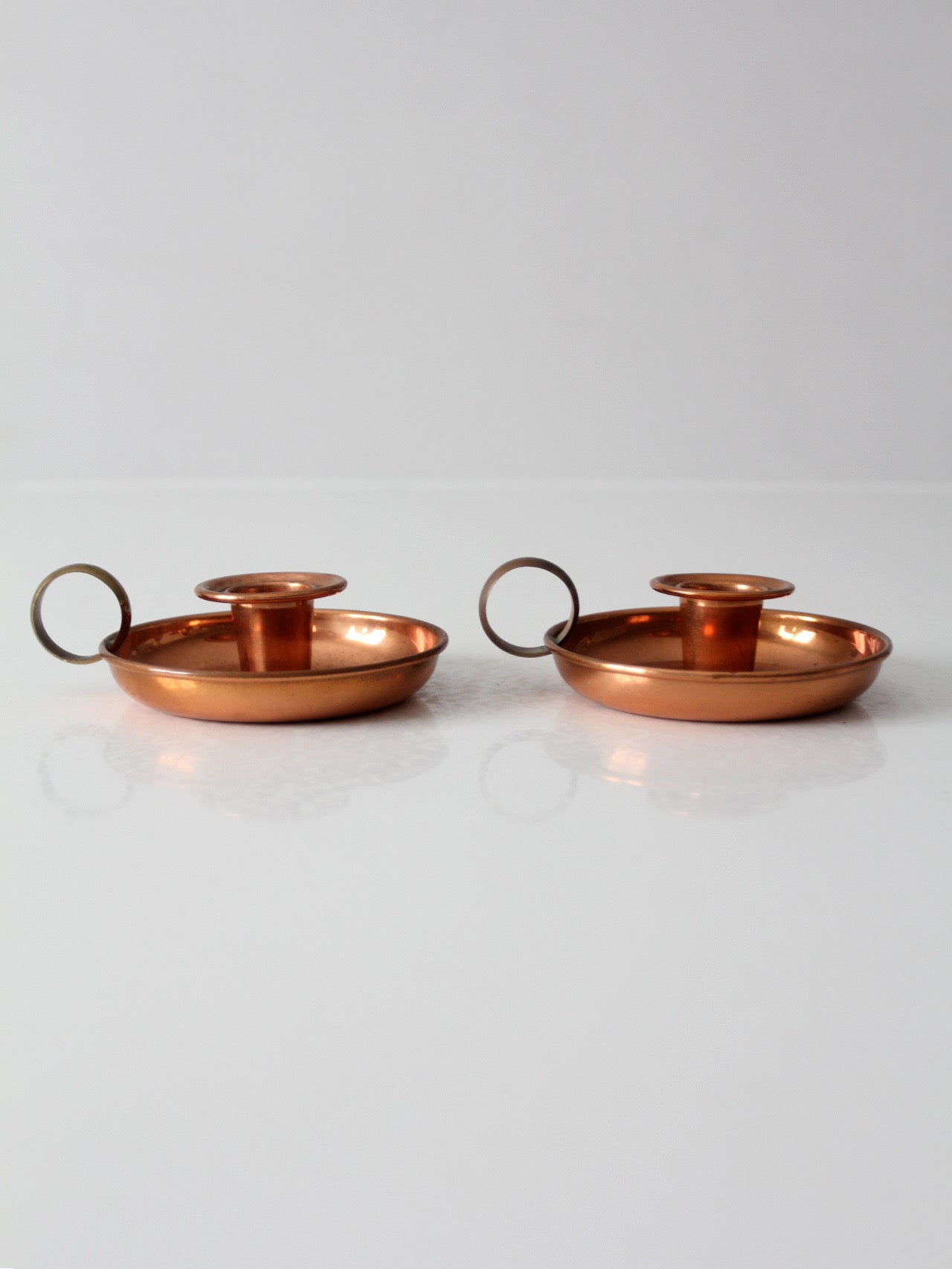 pair of vintage copper and brass chamberstick candlesticks