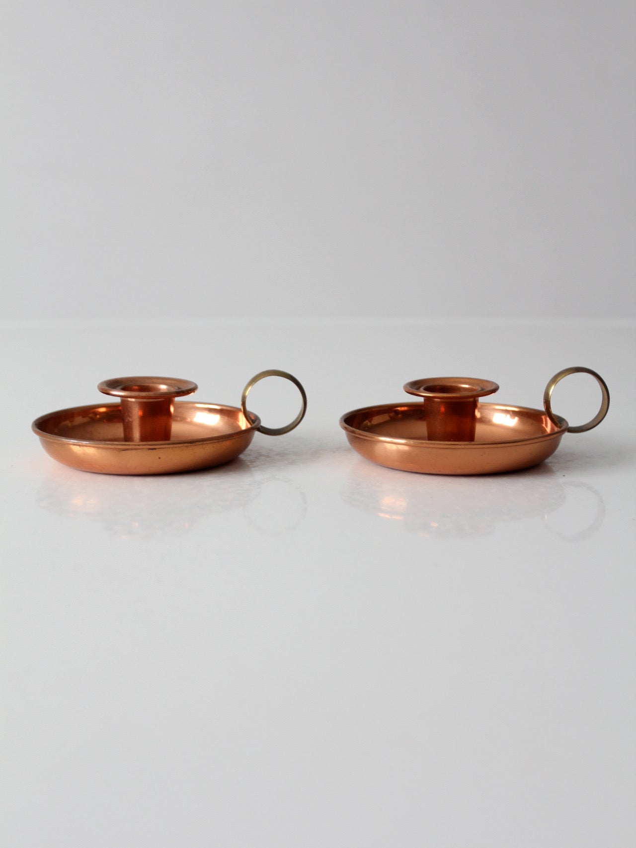pair of vintage copper and brass chamberstick candlesticks