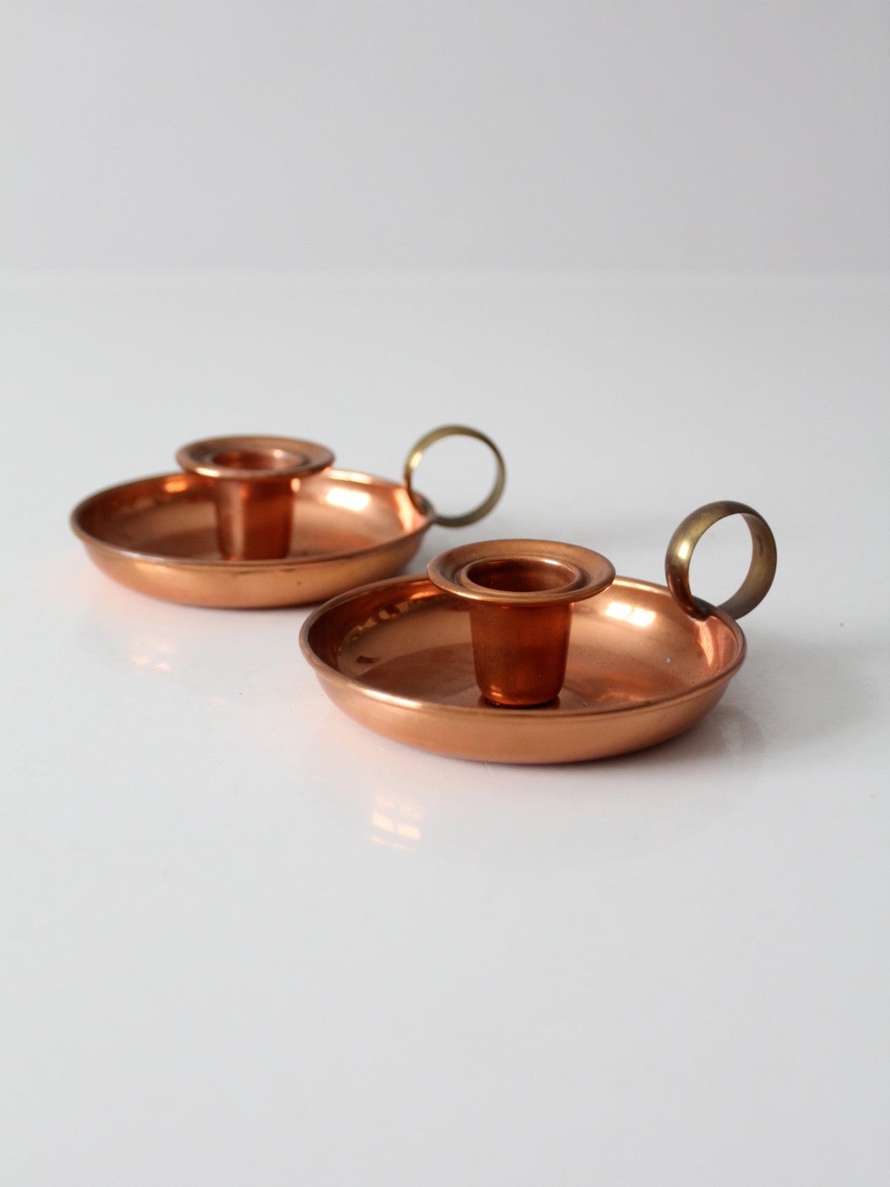 pair of vintage copper and brass chamberstick candlesticks