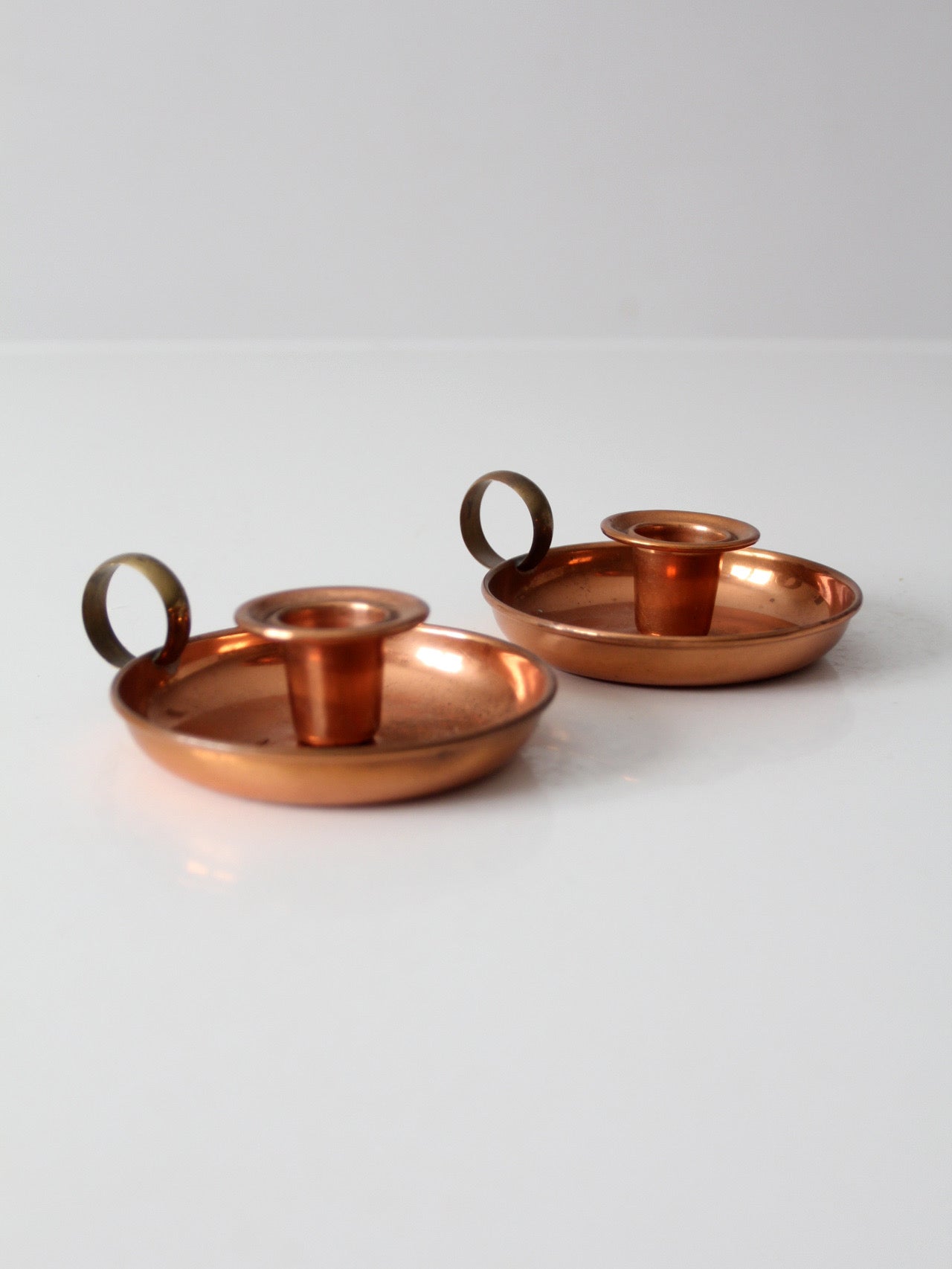 pair of vintage copper and brass chamberstick candlesticks