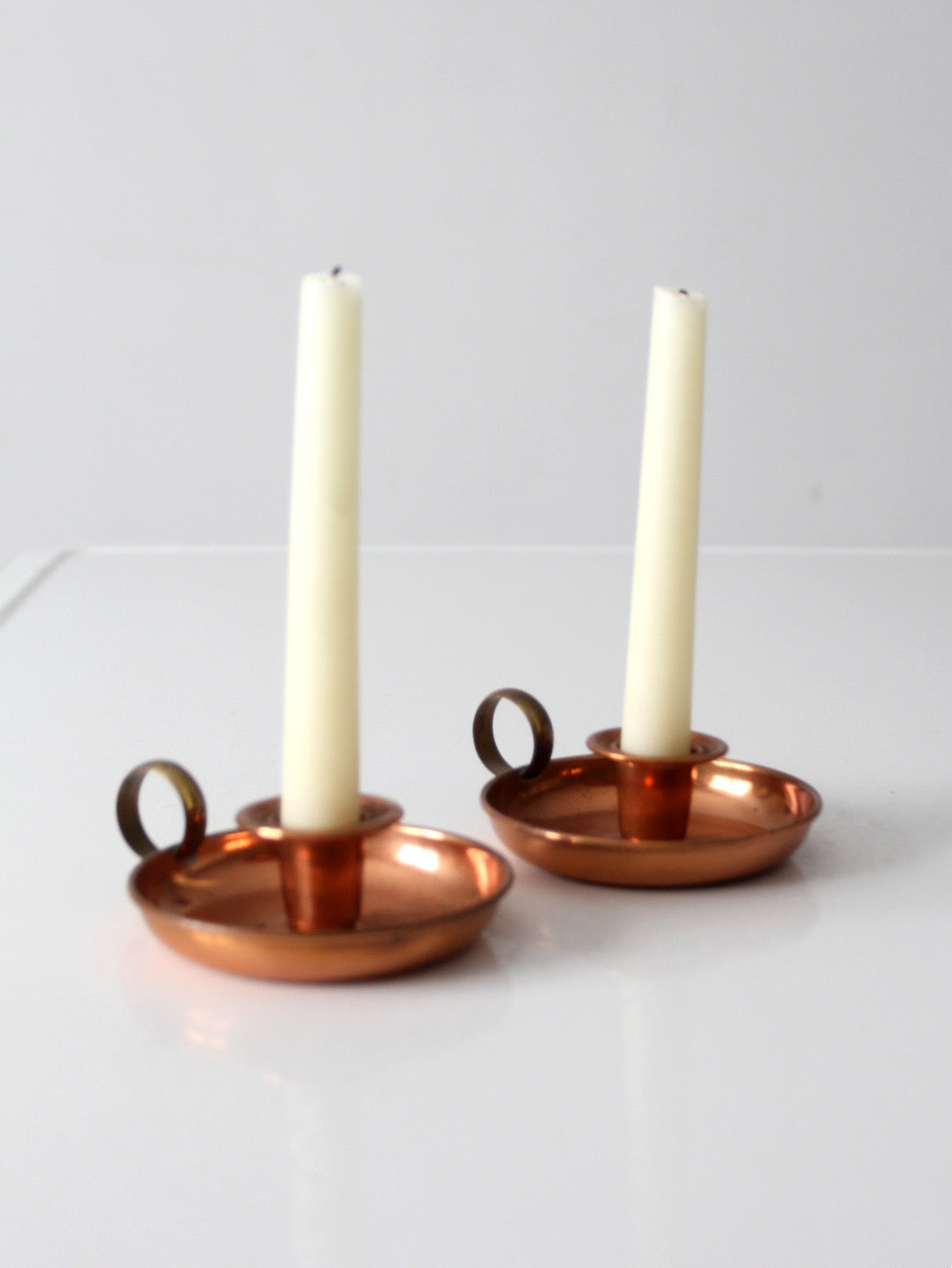 pair of vintage copper and brass chamberstick candlesticks