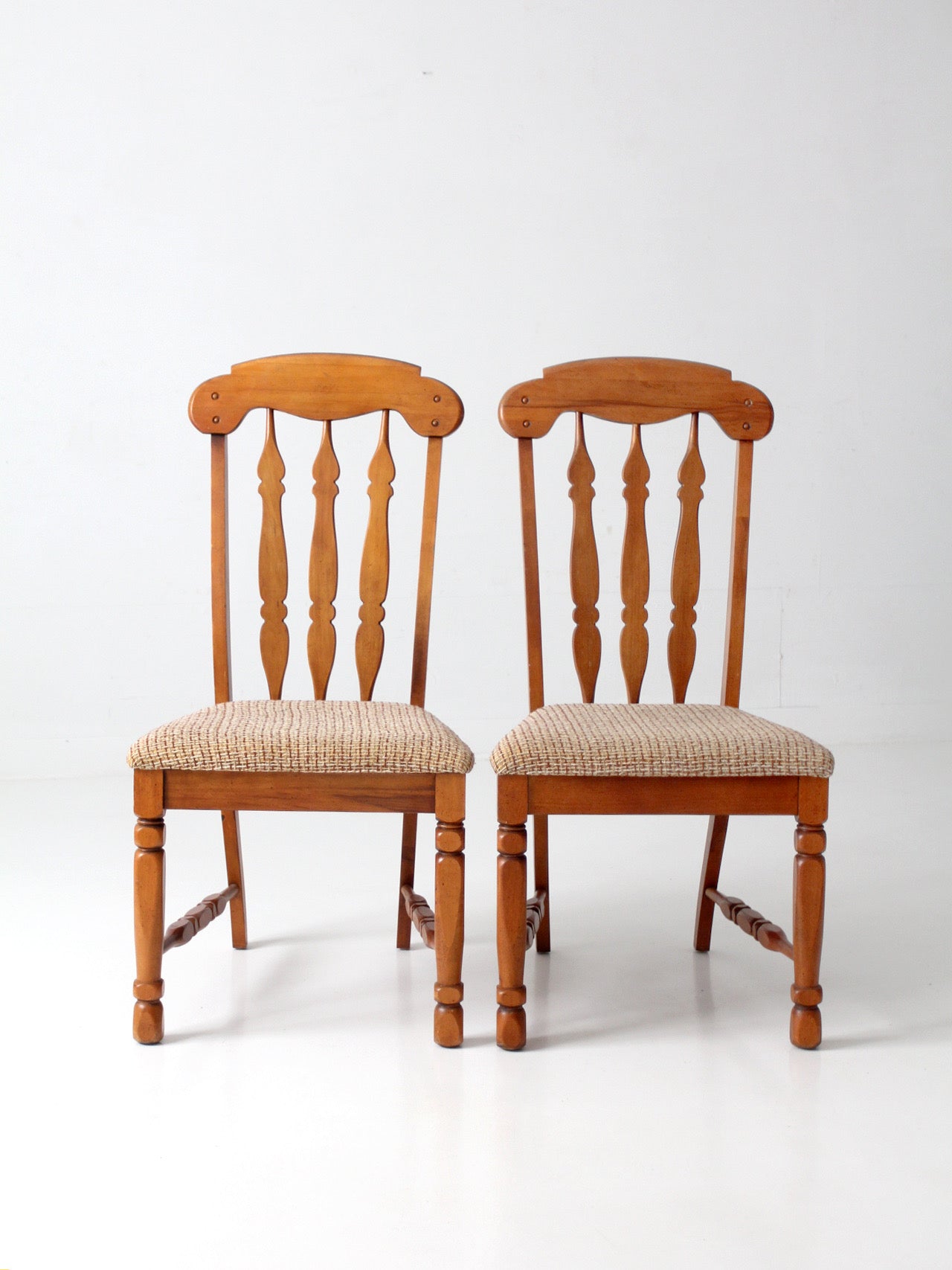 pair of mid-century Singer Furniture wood dining chairs with upholstered seats