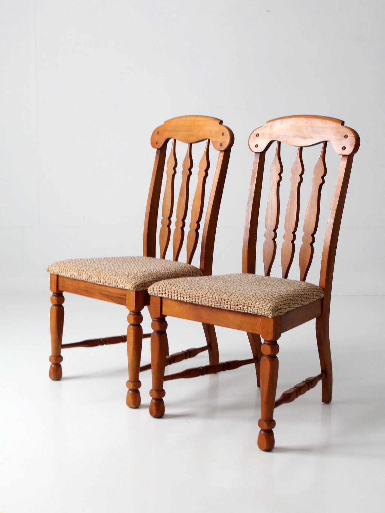 pair of mid-century Singer Furniture wood dining chairs with upholstered seats