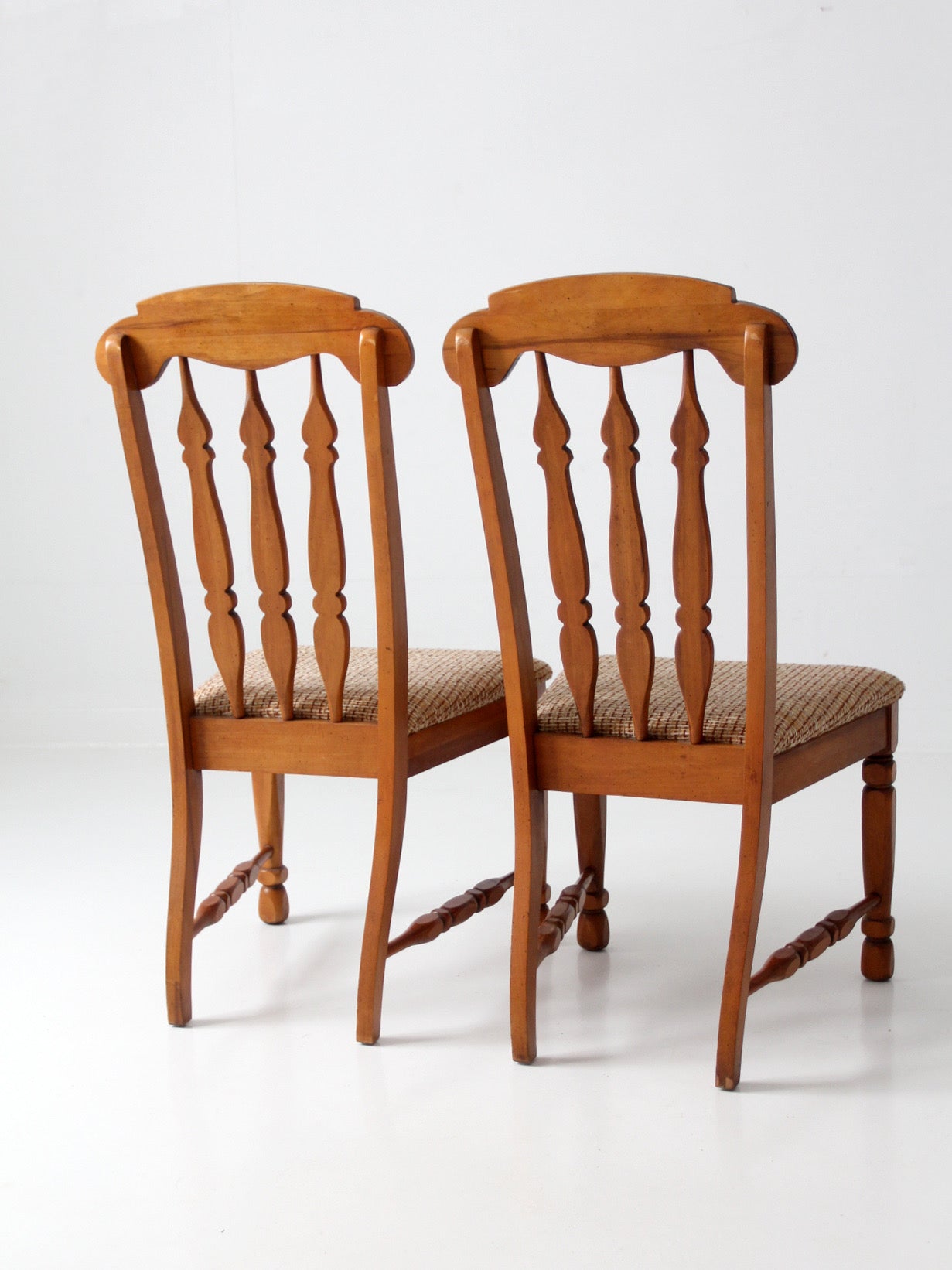 pair of mid-century Singer Furniture wood dining chairs with upholstered seats