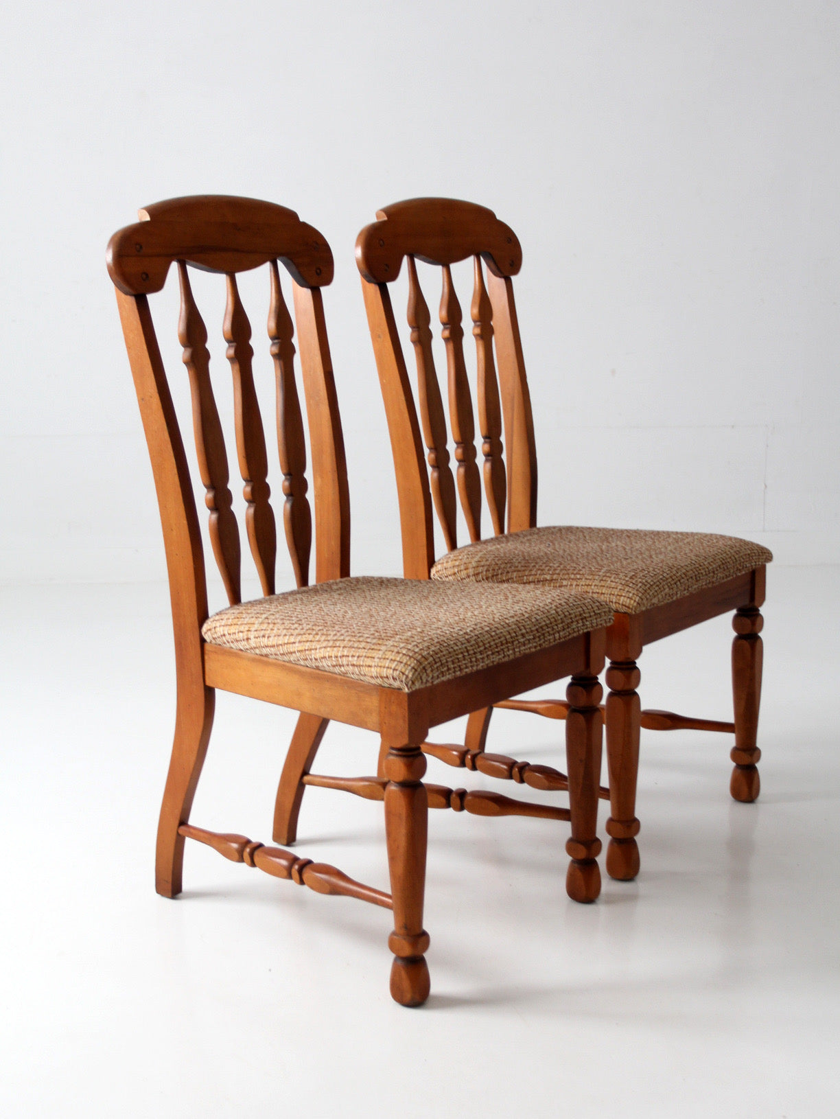pair of mid-century Singer Furniture wood dining chairs with upholstered seats