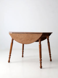 mid-century Dearborn Co drop leaf dining table with extensions