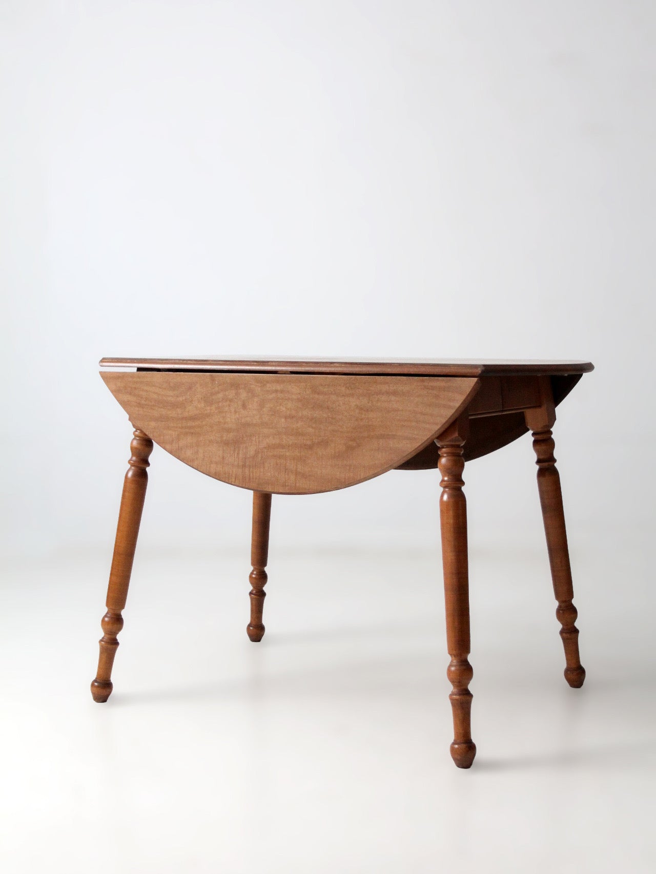 mid-century Dearborn Co drop leaf dining table with extensions