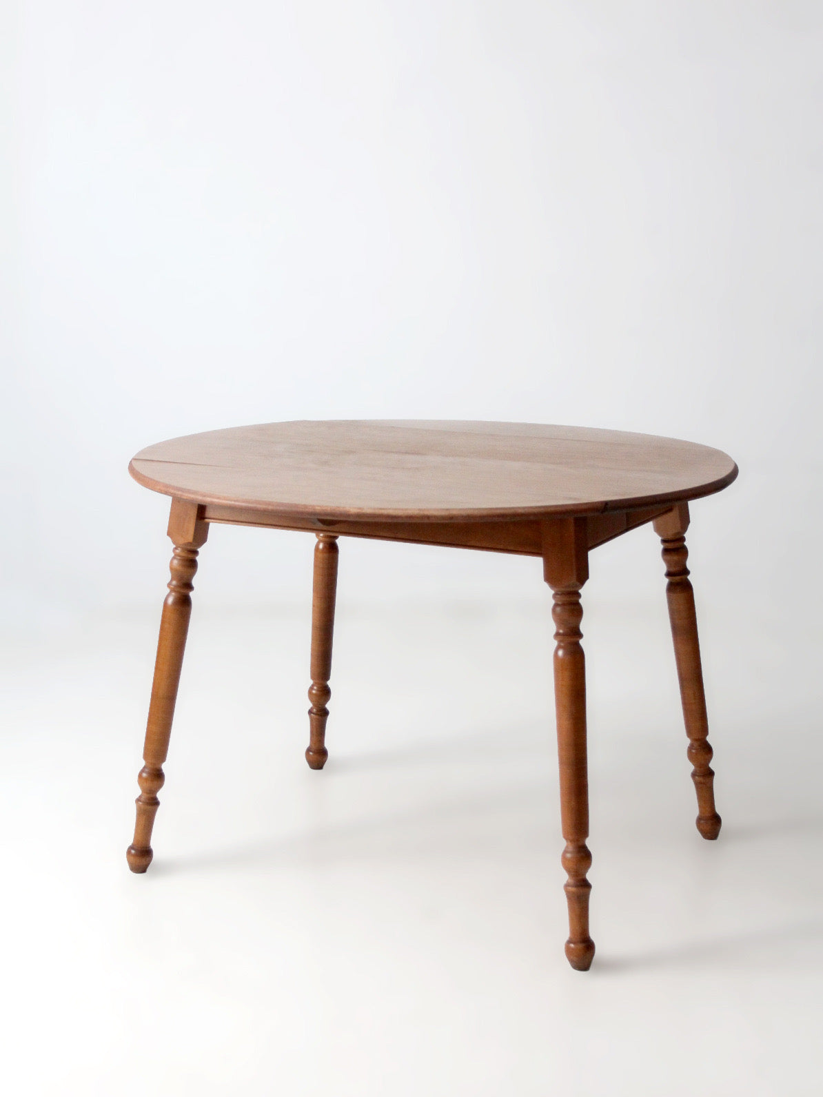 mid-century Dearborn Co drop leaf dining table with extensions