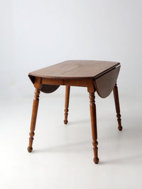 mid-century Dearborn Co drop leaf dining table with extensions