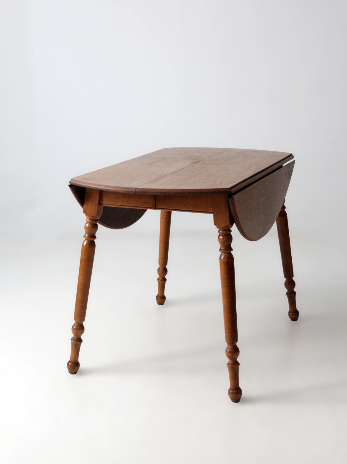 mid-century Dearborn Co drop leaf dining table with extensions