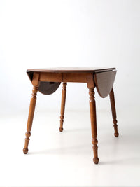 mid-century Dearborn Co drop leaf dining table with extensions