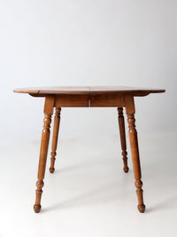 mid-century Dearborn Co drop leaf dining table with extensions