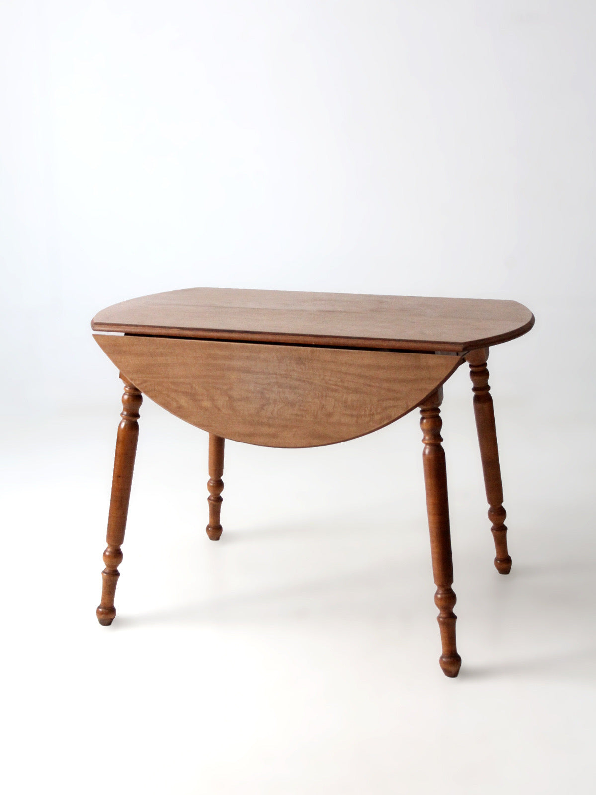 mid-century Dearborn Co drop leaf dining table with extensions