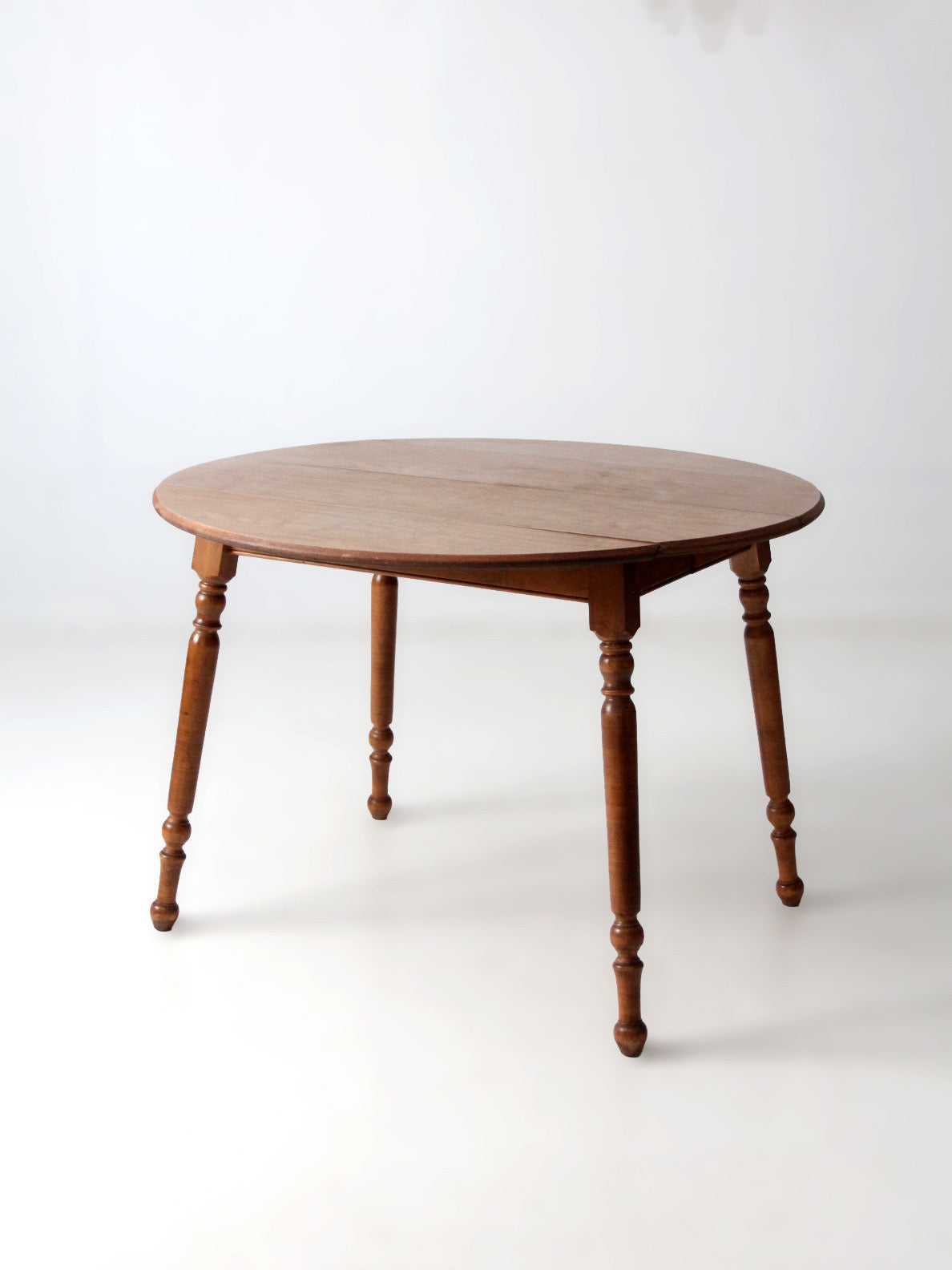 mid-century Dearborn Co drop leaf dining table with extensions