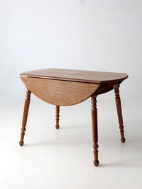 mid-century Dearborn Co drop leaf dining table with extensions