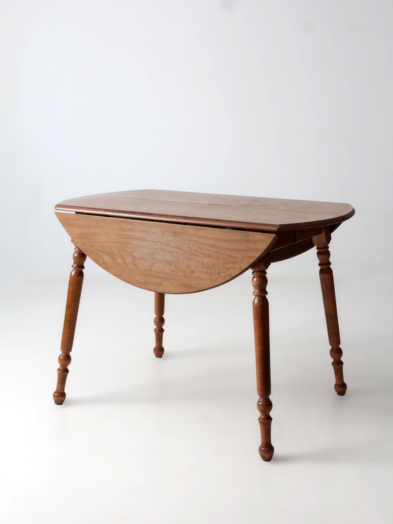 mid-century Dearborn Co drop leaf dining table with extensions