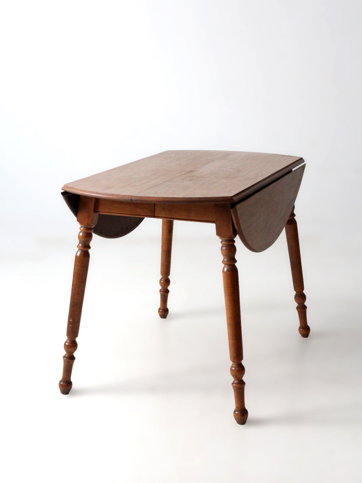 mid-century Dearborn Co drop leaf dining table with extensions