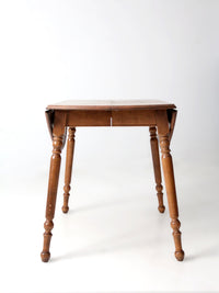 mid-century Dearborn Co drop leaf dining table with extensions