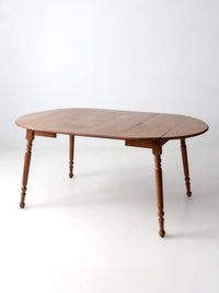 mid-century Dearborn Co drop leaf dining table with extensions