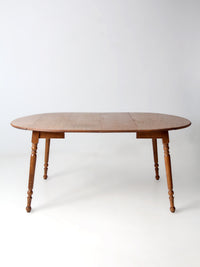 mid-century Dearborn Co drop leaf dining table with extensions