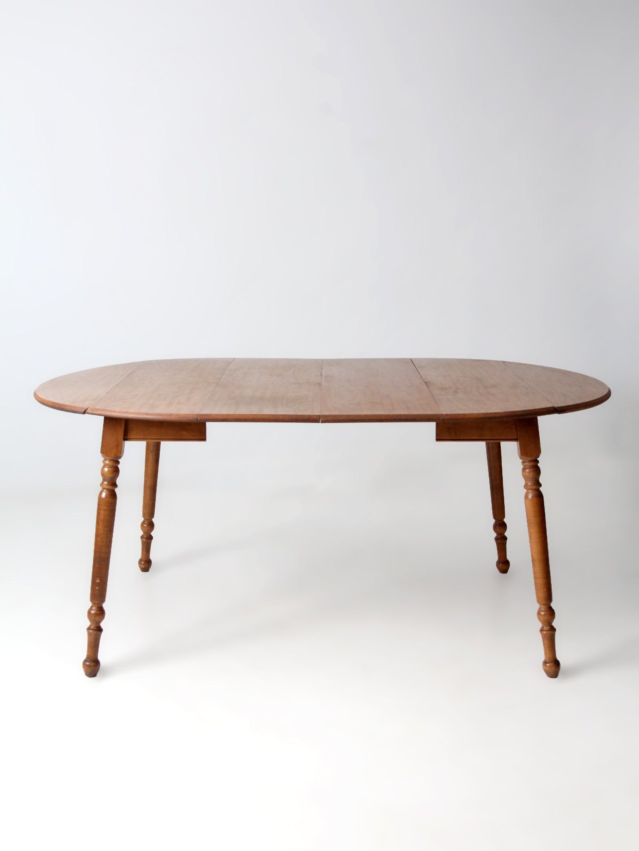 mid-century Dearborn Co drop leaf dining table with extensions