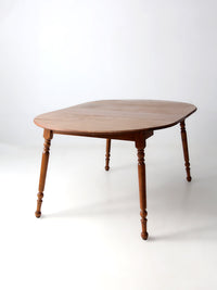 mid-century Dearborn Co drop leaf dining table with extensions