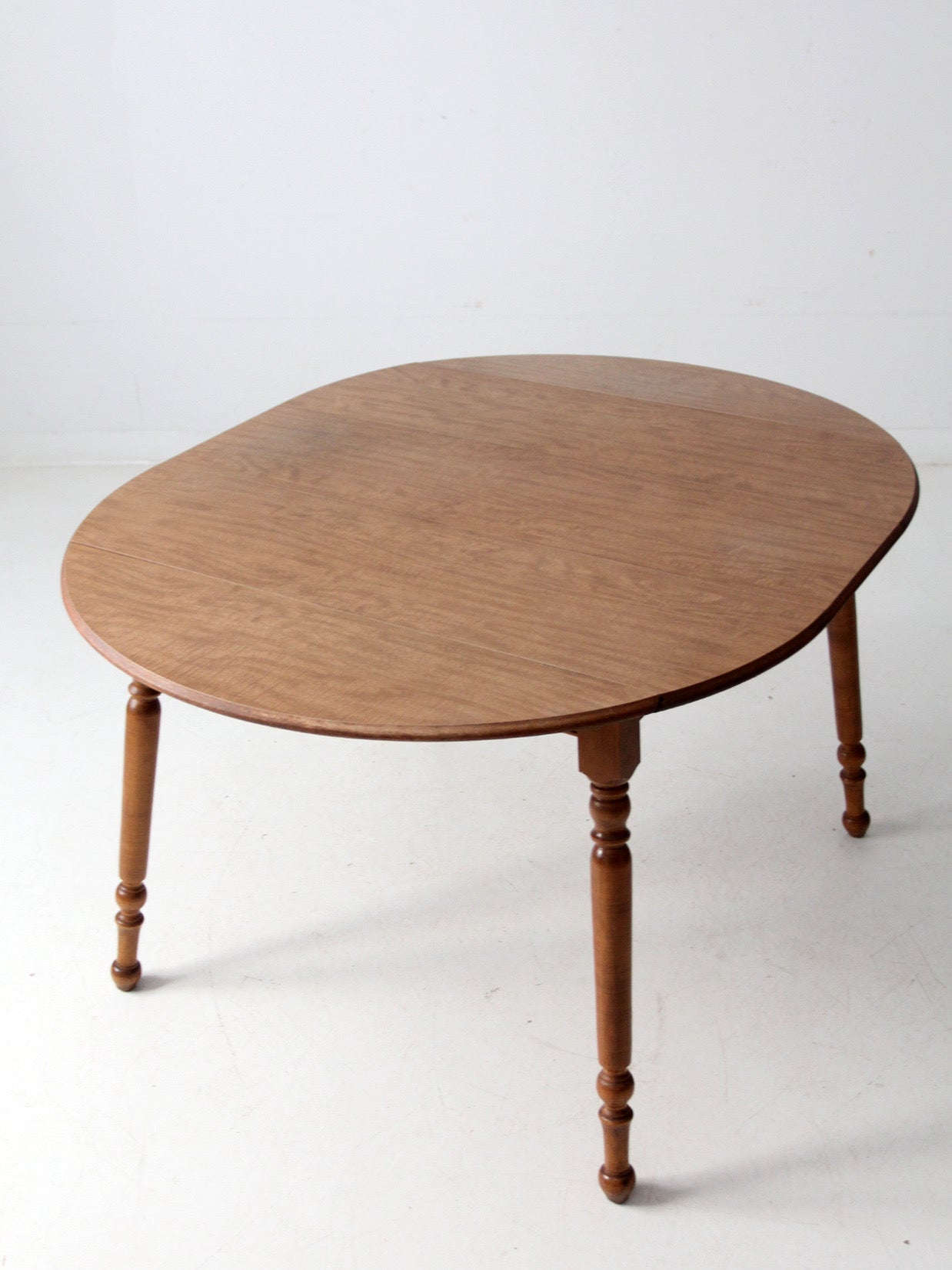 mid-century Dearborn Co drop leaf dining table with extensions