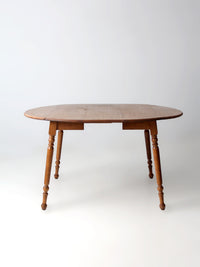 mid-century Dearborn Co drop leaf dining table with extensions
