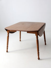 mid-century Dearborn Co drop leaf dining table with extensions