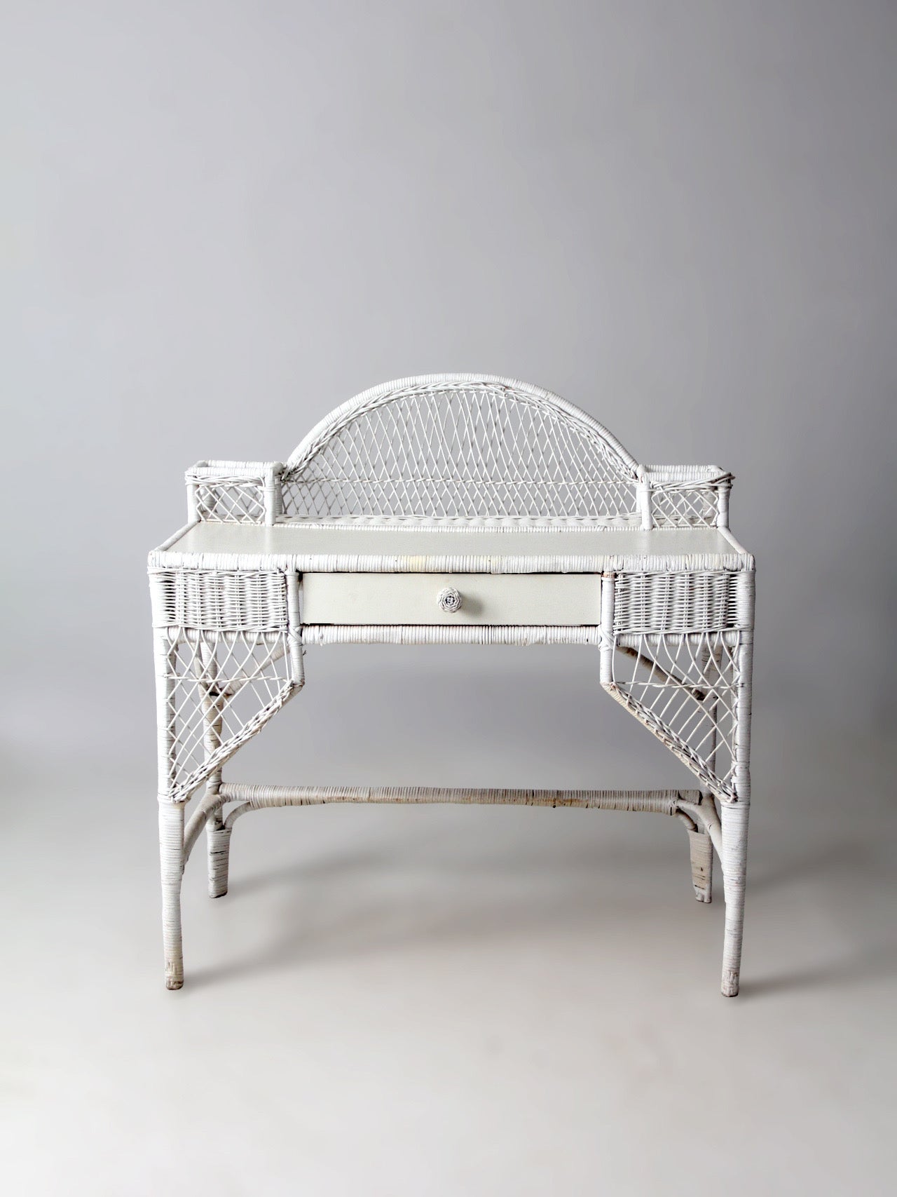 early 20th century American wicker desk with drawer