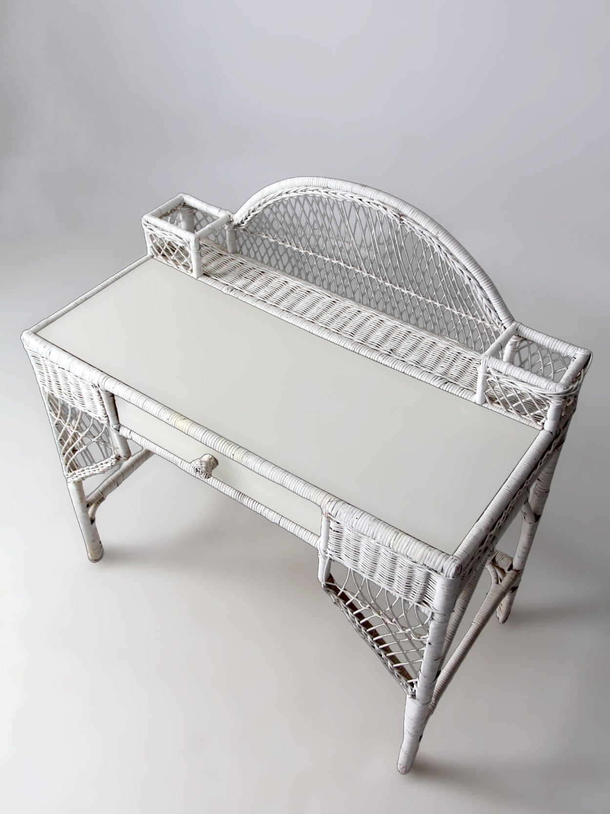 early 20th century American wicker desk with drawer