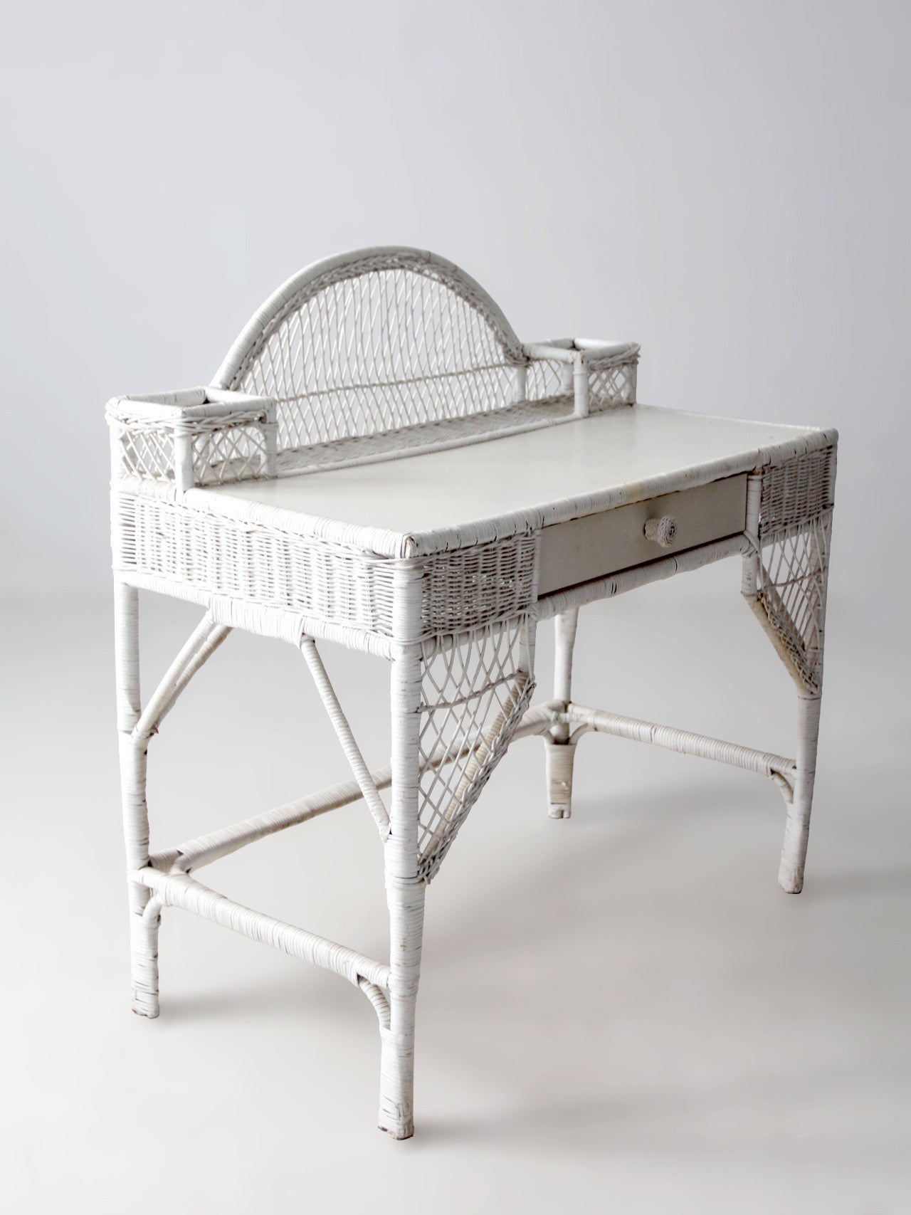 early 20th century American wicker desk with drawer