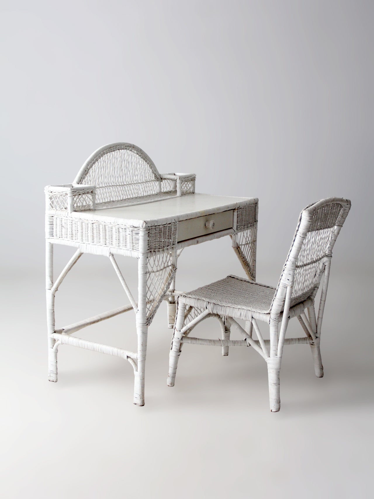 early 20th century American wicker desk with drawer