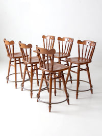 mid-century Tell City swivel counter stools