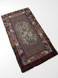 antique hand-hooked floral wool rug