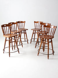 mid-century Tell City swivel counter stools