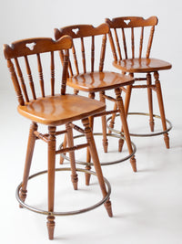 mid-century Tell City swivel counter stools