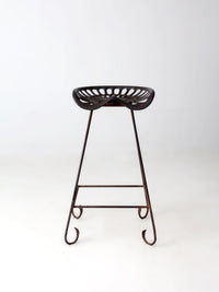 antique Deering tractor seat stool