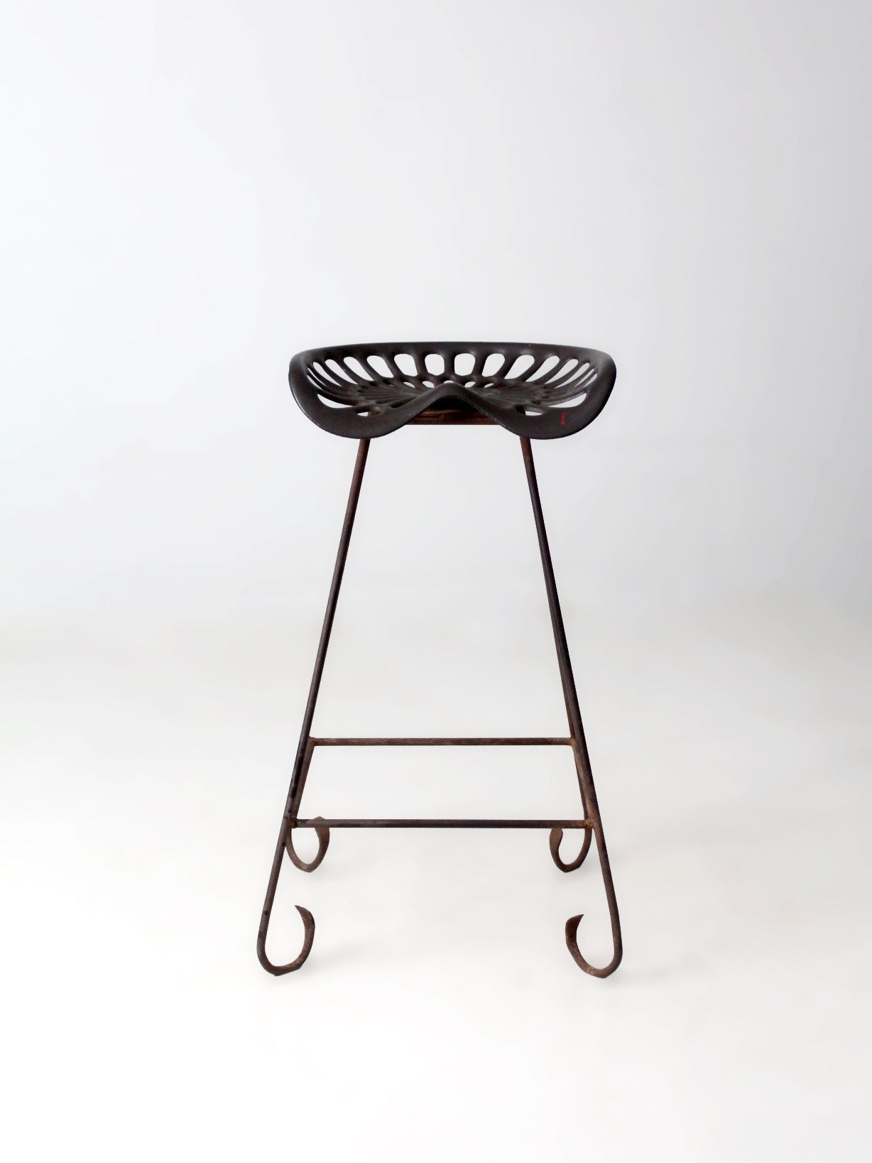 antique Deering tractor seat stool