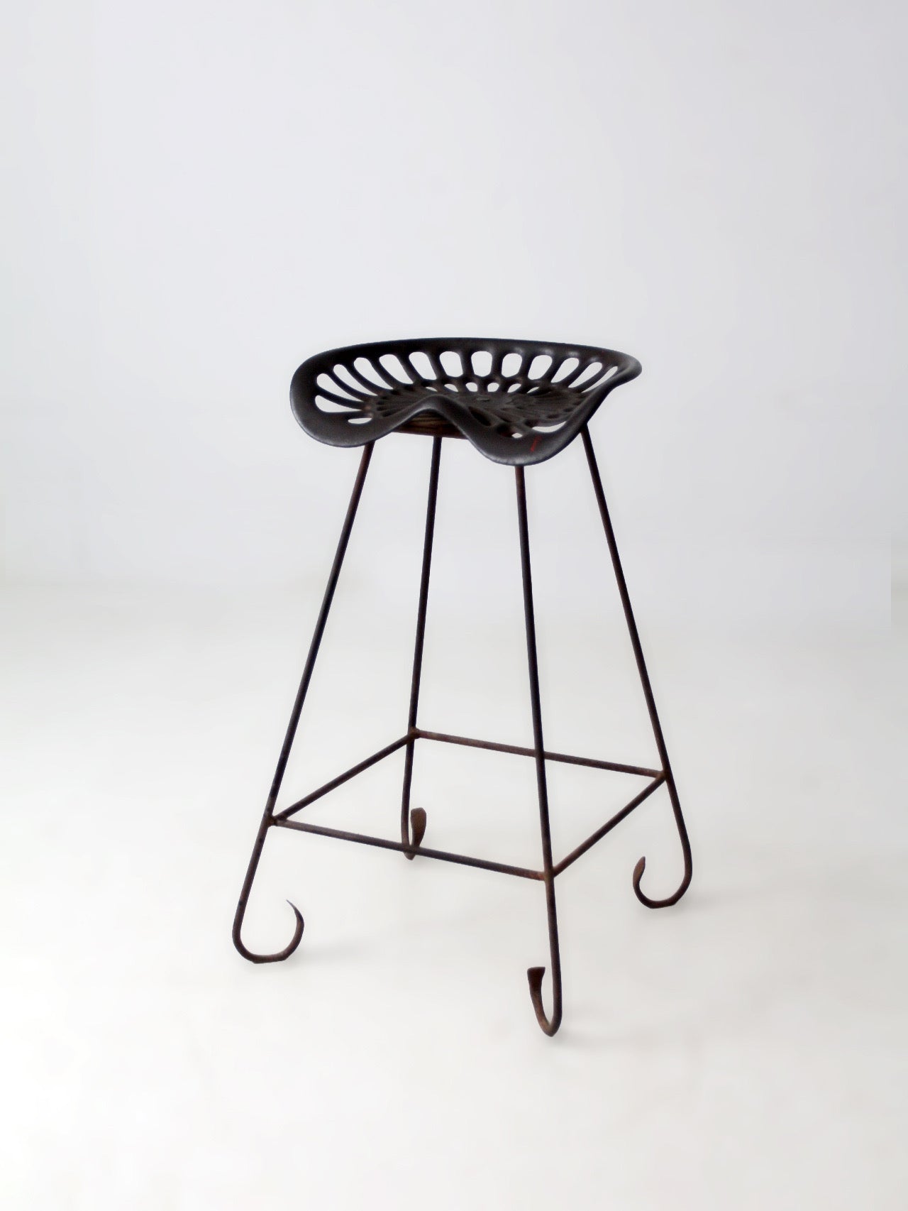 antique Deering tractor seat stool