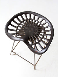 antique Deering tractor seat stool