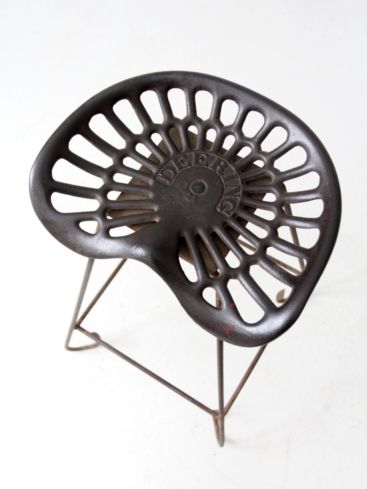 antique Deering tractor seat stool