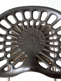 antique Deering tractor seat stool