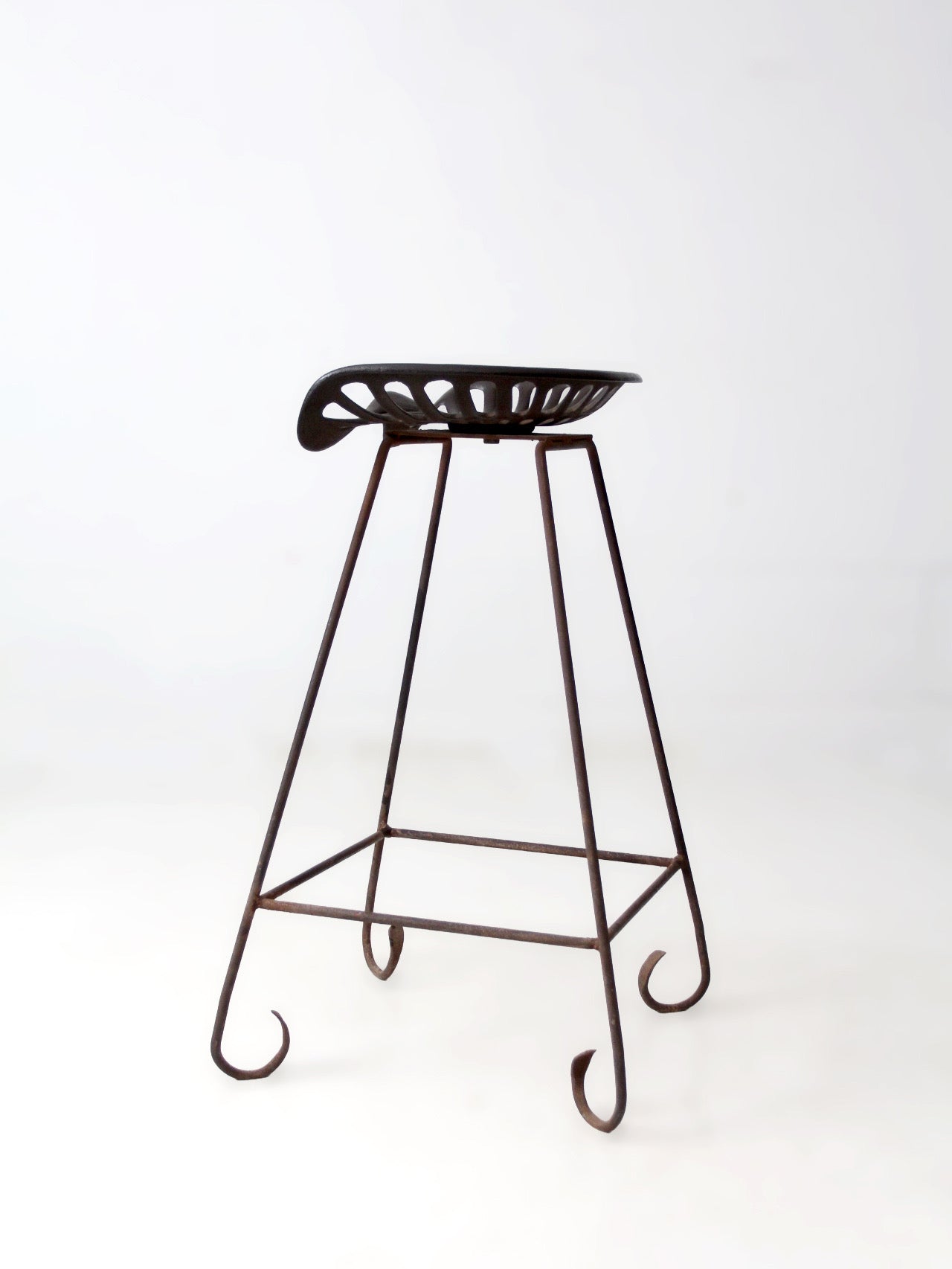 antique Deering tractor seat stool