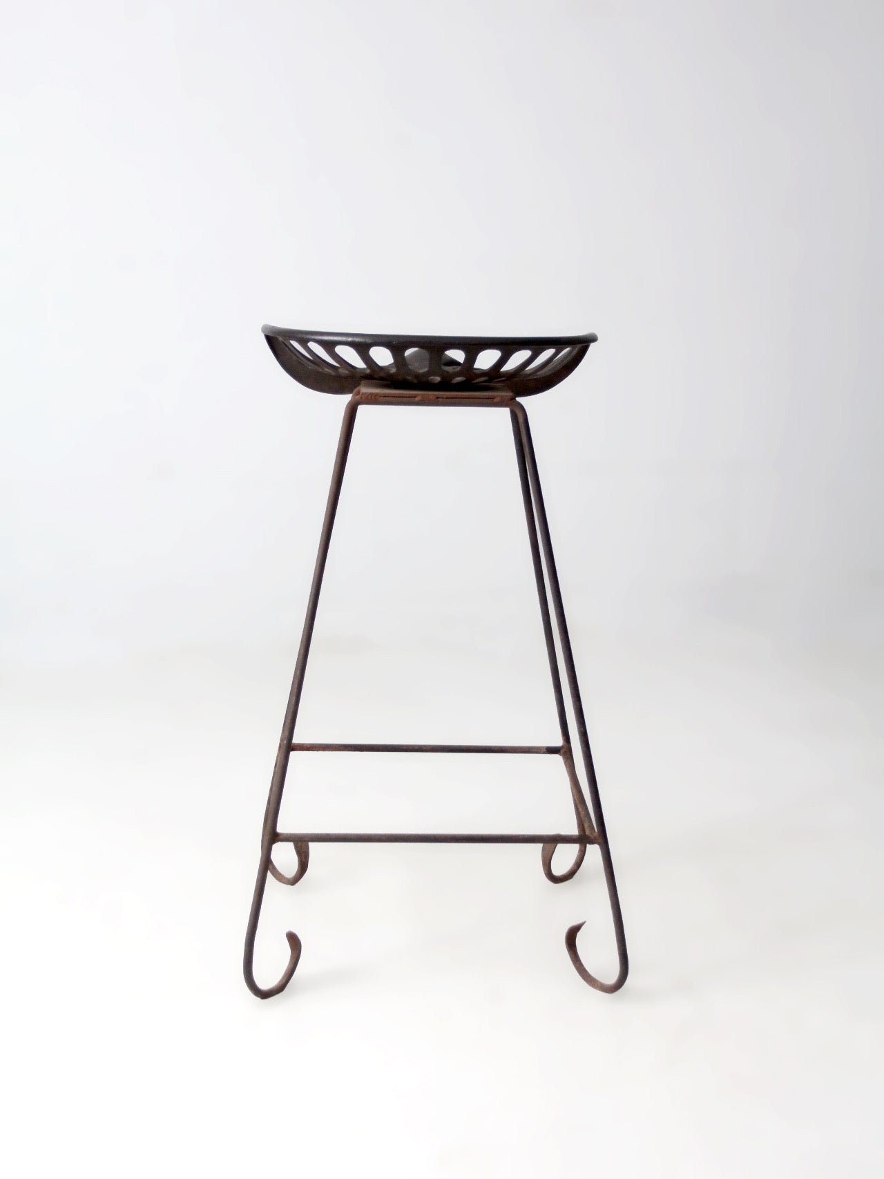 antique Deering tractor seat stool