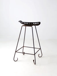 antique Deering tractor seat stool
