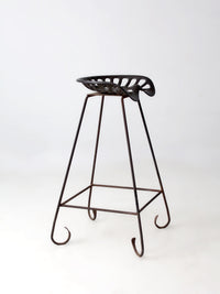 antique Deering tractor seat stool