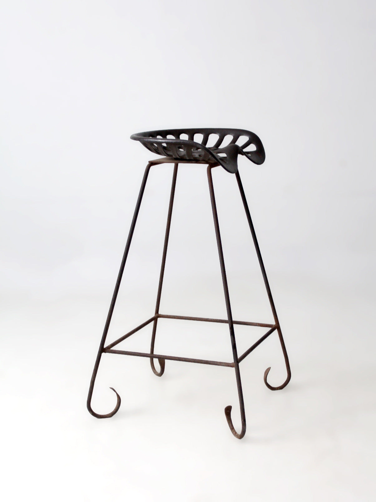 antique Deering tractor seat stool