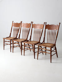 antique griffin crest press back dining chairs | set of 4